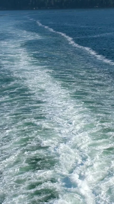 Wake of vessel. Wide wake trail from boat. Back view. Ocean water. Deep blue Stock Footage 301300279