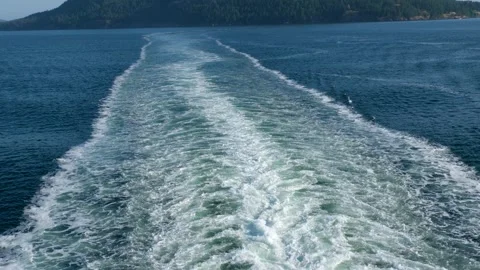 Wake of vessel. Wide wake trail from boat. Back view. Ocean water. Deep blue Video stock 303633883