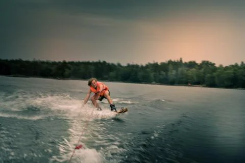 Wakeboard behind boat: action sport shot in "Bad Wheather thunderstorm" Stock Photos