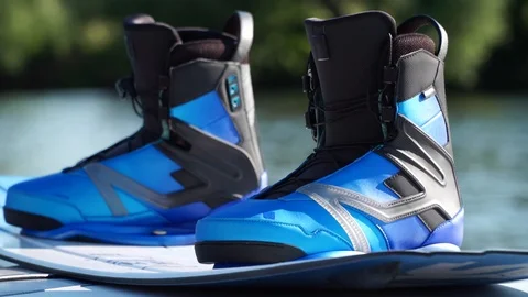 Wakeboard with bindings, water in the background Stock-Footage 91968180