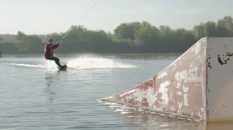 Wakeboarder jump with springboard Stock Footage 59319724