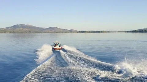 Wakeboarder jumping over wake and crashing Stock Footage 82869348