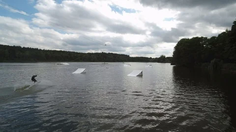 Wakeboarder on Lake transitioning Stock Footage 107614021