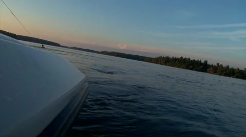 Wakeboarder man riding waves behind speed boat Stock Footage 67228987