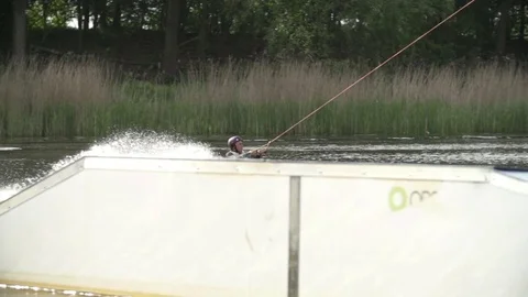 Wakeboarder performing a raley [Slomo] Video stock 70133327