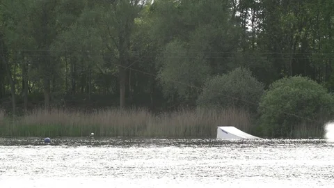 Wakeboarder performing a raley [Slomo] Stock Footage 70134620
