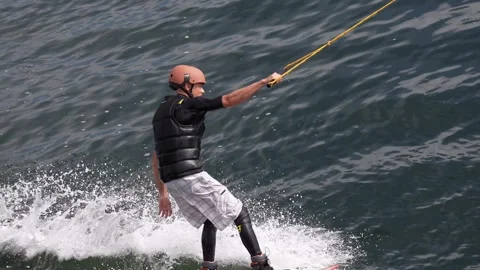 Wakeboarder ride on cable wakeboard in park, outdoor extreme on water Stock Footage 244011586