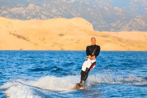 Wakeboarder in sunset. Stock Photos