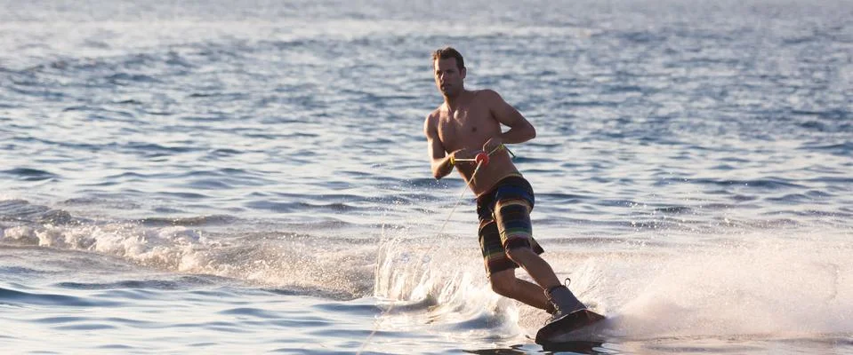 Wakeboarder in sunset. Stock Photos