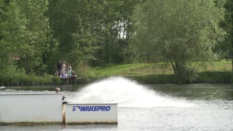 Wakeboarder tries to perform a s-to-blind but fails [Slomo] Stock Footage 70133495