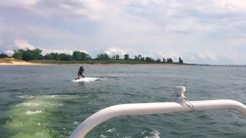 Wakeboarding behind boat in slow motion Stock Footage