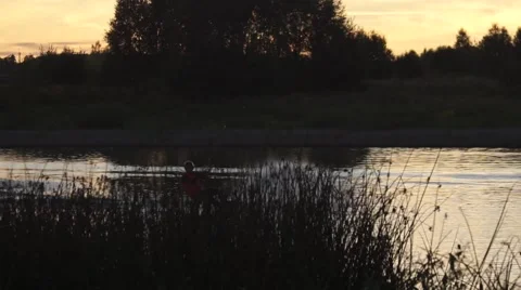 Wakeboarding, frontside backroll on a sunset Stock Footage 67354935