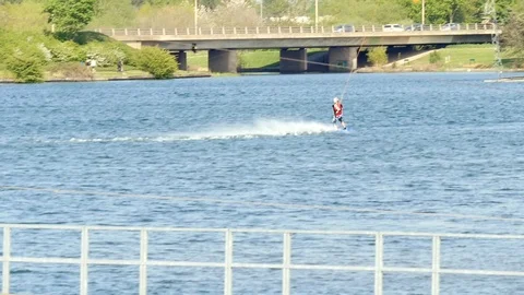 Wakeboarding over a jump in slow motion Stock Footage 106990067