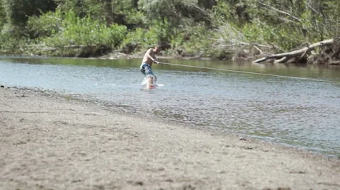 Wakeboarding on the river Stock Footage 69048298