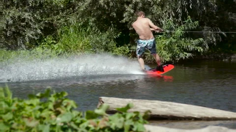 Wakeboarding on the river Stock Footage 69049934