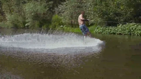 Wakeboarding on the river Stock Footage 69078604