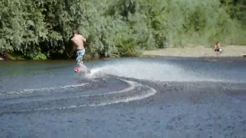 Wakeboarding on the river Stock Footage 69078606