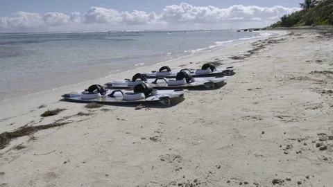 Wakeboards kept in a row on the beach Stock Footage 74906672