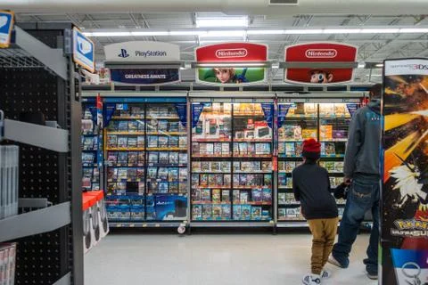 Wal-Mart Video Game Section Little Boy Looking at Games Shopping Scene Decemb Stock Photos