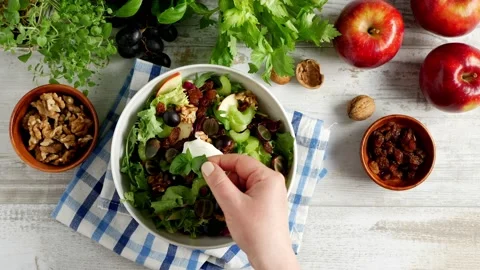 Waldorf salad. Decorating the dish with basil leaves. Stock Footage 139740317