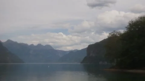 Walensee lake timelapse, cloudy sky and calm water, Weesen Switzerland Video stock 348123115