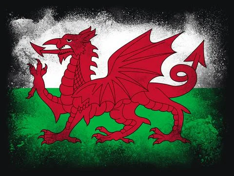 Wales Flag design composition of exploding powder and paint, isolated on a bl Stock Illustration