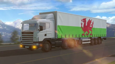 Wales flag shown on the side of a large truck Stock Footage 122107266