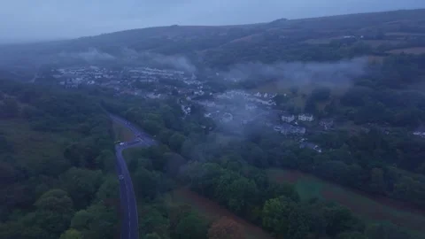 Wales, flying through a cloud, approaching a village. Aerial view. Stock Footage 344907615