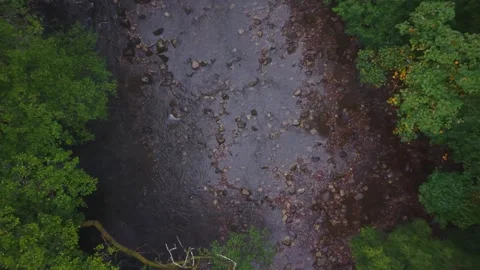 Wales, top-down view and drone descent down to the shallow river Stock Footage 344907613
