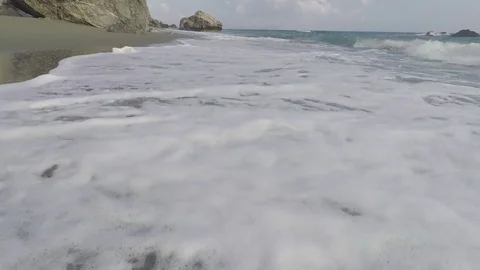 Walk above the Waves Foam in a Sandy Beach Stock Footage 75891186
