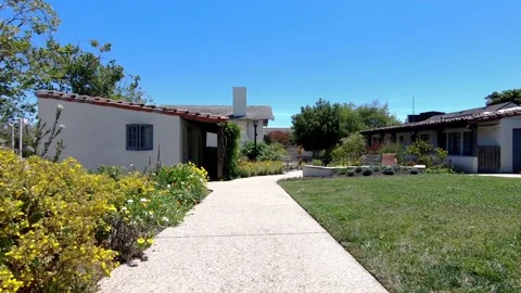 Walk along garden path in Parque de los Californios in Monterey, California Stock Footage 143430954