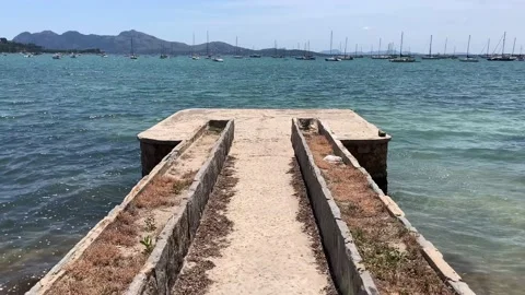 Walk along the old stone jetty in front of the sea. First person view walking Stock Footage 131456449