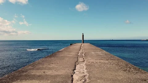 Walk along the old stone jetty in front of the sea. First person view walking Stock Footage 134405674