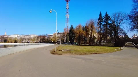 Walk along the park path by the lake on a clear sunny day in the city center Stock-Footage 332040532