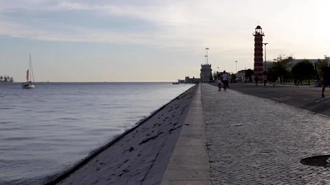 Walk along the river Tagus from the Belem tower to the monument of discoveries  Stock Footage 138066792