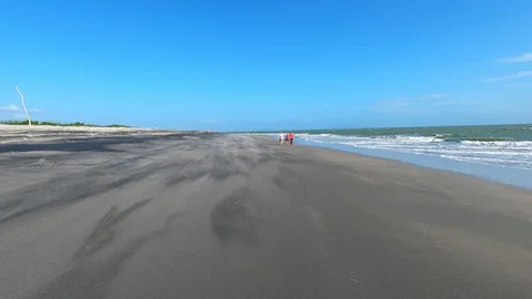 Walk along the windy beach in Punta Chame Panama Stock Footage 125039949