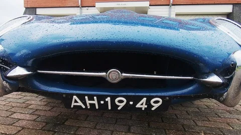 Walk around the blue Jaguar E type and look inside Stock-Footage 117170700