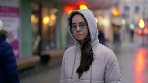 Walk in city in cold day with sleet, portrait of adult woman dressed in casual Видео 242101439