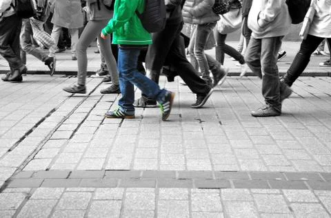 Walk colored different characters in the gray crowd Stock Photos