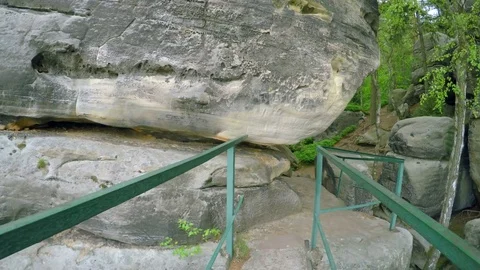 Walk in corridor between great sand rocks. Stock Footage 77263470