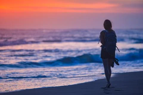 Walk down the Beach at Sunset Stock Photos