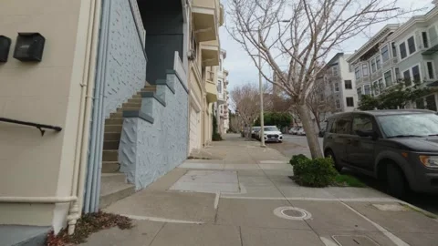 Walk down a concrete sidewalk on a hilly San Francisco street, Stock Footage 336165335