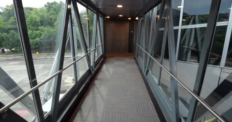 Walk at empty jet bridge from airliner to terminal, slow motion shot Stock Footage 315205334
