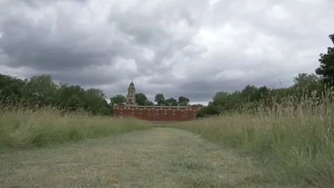 Walk from the grass towards a old ancient stable Video stock 133738985