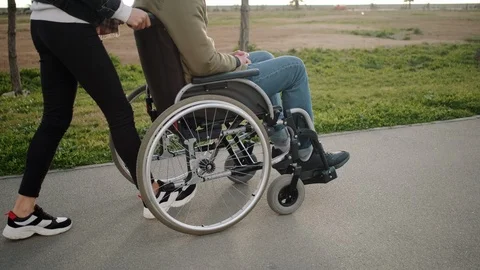 Walk with handicapped husband Stock Footage 116624524
