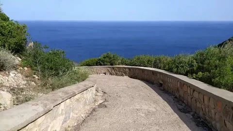 Walk hyperlapse in rocky path in coastline hill Stock Footage 266298127