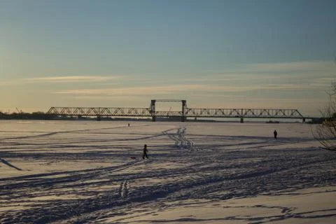 Walk on the ice under the rays of the winter sun Stock Photos