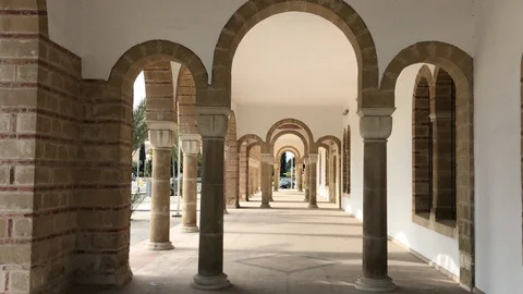 Walk inside exterior Columns of St George Monastery in Larnaca Stock-Footage 89567444