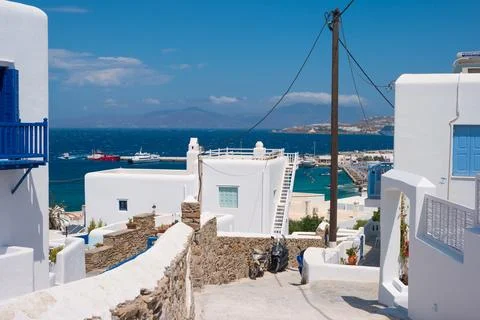 Walk path between greek rustic white houses Stock Photos