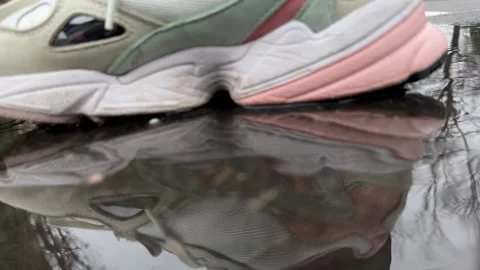 Walk in puddle on the street Stock-Footage 230076252